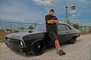 Murder Nova standing in front of his car.
