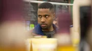 Richard is in the grocery store with a menacing look on his face.