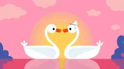 Der Schwan und die Schwänin schauen sich in die Augen.