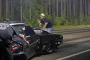 Kye Kelley helps Bobby Ducote set his car straight at the starting line.