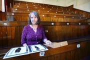 Dr. Joyce Tyldesley - Egyptologist - pictured with images of the mummified fetus' found in Tut's tomb