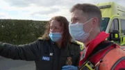 Paramedic Andy talking to ambulance staff at the scene of the accident