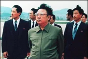 Photo dated 17 April shows North Korean leader Kim Jong-Il (C) on the tarmac at Pyongyang Airport following a visit by then Chinese President Yang Shangkun.