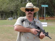 Jim Green shows off a small, but deadly, sub-machine gun.