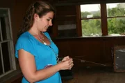 Spiritual medium, Corinne Martin, gets an initial read of the spirits in the house.
