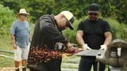 L-R: Juan Ibarra, Travis Stockman, sawing piece of metal