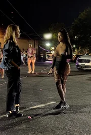 Mariana van Zeller (L) talking with D’NISHA outside a nightclub.