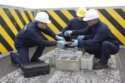 RCMP Explosives Unit carefully place dynamite in the tuner