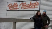 Hosts Katrina Weidman and Jack Osbourne posing in front of the Bobby mackey's sign in Kentucky. As seen on Travel Channel's Portals To Hell.
