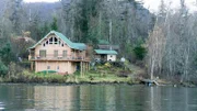 The exterior of the first home which is located on a small island named Loon Island.