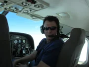 Jeff Dunn pilots a helicopter with brand new tracking equipment above the sanctuary.