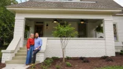 Ben and Erin Napier in front of the Alway house on reveal day, as seen on Home Town, Season 7.