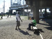 Earl being filmed talking to Leigh and Spencer on their first day of work.