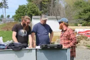 The Maine Cabin Masters discuss plans for the gigantic deck they are making for Travis Mills' Veterans Retreat in Rome, Maine that must be ADA accessible, as seen on Maine Cabin Masters.