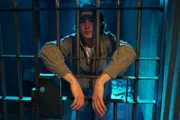 Man behind bars.