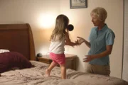 In this recreated scene, Cindy Anthony plays with Caylee in her room.