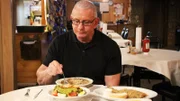 Robert tastes The Balcony's food for the first time, as seen on Restaurant Impossible, season 16.