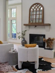 The Downey family home looks stunning with the fireplace and seating as what draws one upon entering.