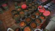 Aerial shot of chili mash in barrels lined up.