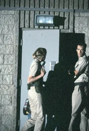 Harmon Rabb, Jr. (David James Elliott), Meg Austin (Tracy Needham)