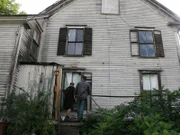Brian Gurry and Lee Danley check out the school house before they bid.
