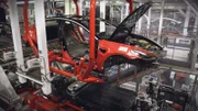 Red shell of Tesla on production line. (National Geographic/Alex Macdonald)
