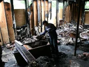 Brian explores to the fire-damaged house in search of treasures he can scavenge.