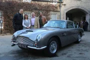 Fuzz Townshend and Tim Shaw stand next to the restored Aston Martin DB6. With them are car owner Stephen Farguhar and his wife Andrea Schou.
