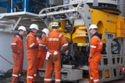 The crew gather around the Seabed WorkerÕs HD ROV.SONY DSC