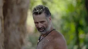Gary looking off to the side.