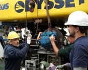 ROV Technician Jesus Vasques Perez, Project Manager Mark Martin, and ROV Supervisor Ewan Bason prepare to remove Zeus' faulty motor.