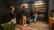 Chip, Jo, and Ben talk in the library as seen on episode 106 of Fixer Upper: Hotel.
