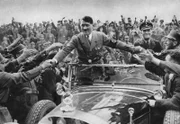 1933: Adolf Hitler (1889 - 1945), Bundeskanzler von Deutschland, wird von Anhängern in Nürnberg empfangen.