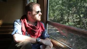 Josh Gates takes a train on the way to Hungary.