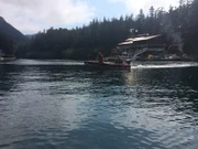 Matthew Brown and Gabriel Brown in skiff returning to the Integrity.