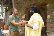 Justin Fornal introduces himself to High Priest Aba Kidane Mariam.