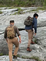 L-R: Justin and Emiliano walking up some rocks.