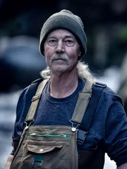 Wesley Richardson in hat and dungarees.