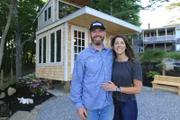 Oyster Farm owner Ryan poses with his girlfriend Briana in front of the newly built Oyster Farm shack, for Ryan McPherson's Oyster Farm Shack build, in Edgecomb, Maine, as seen on DIY Network's Maine Cabin Masters.