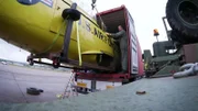 Michael Manousakis cracks convert a US Army vehicle.