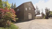 Exterior, side of Clover Pass Waterfront house, driveway, garage, greenhouse, complete with green paint, near Ketchikan, Alaska, as seen on Great American Country's Living Alaska