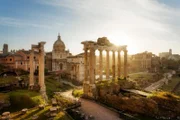 The Roman forum at sunrise with the Temple of Saturn in the foreground in the Roman Forum, Rome, Italy