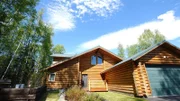 Exterior view of the Pioneer Peak house, one of Matt and Emily Levanduski's stops in their house search near Anchorage Alaska, as seen on Great American Country's Living Alaska