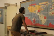 Emiliano Ruprah studies a map at Barry Lawrence Ruderman Antique Maps Inc.