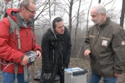 WALBRZYCH, POLAND - Professor Janusz Madej and Assistant Professor Sławomir Porzucek, geologists from AGH University of Science and Technology in Poland show Robert Joe how to carry out the magnetic and gravimetric surveys in order to find out if there is a train buried in the area. Treasure hunters claim there is a Nazi train full of gold hidden underground.