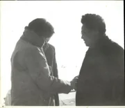 Choi Eun-Hee tentatively shakes Kim Jong-Il's hand.
