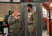 L-R; Doug Heffernan (Kevin James) and Deacon (Victoir Williams)