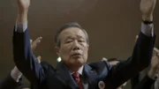 Shot of contributor Kim Shin-Jo with his arms up in prayer. KSJ is an ex North Korean commando who attempted the Blue House Raid and was captured.
