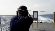 The man shoots at the target.