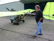 Lee Danley gets a closer look at Bill Beauvais in the Ultralight before the test run.